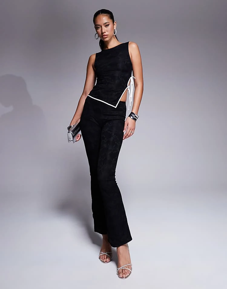 Kaiia Exclusive Lace High Neck Sleeveless Tie Side Asymmetric Hem Top And Flared Trousers Co-ord In Black 4 Kaiia Exclusive Lace High Neck Sleeveless Tie Side Asymmetric Hem Top And Flared Trousers Co-ord In Black - Image 2
